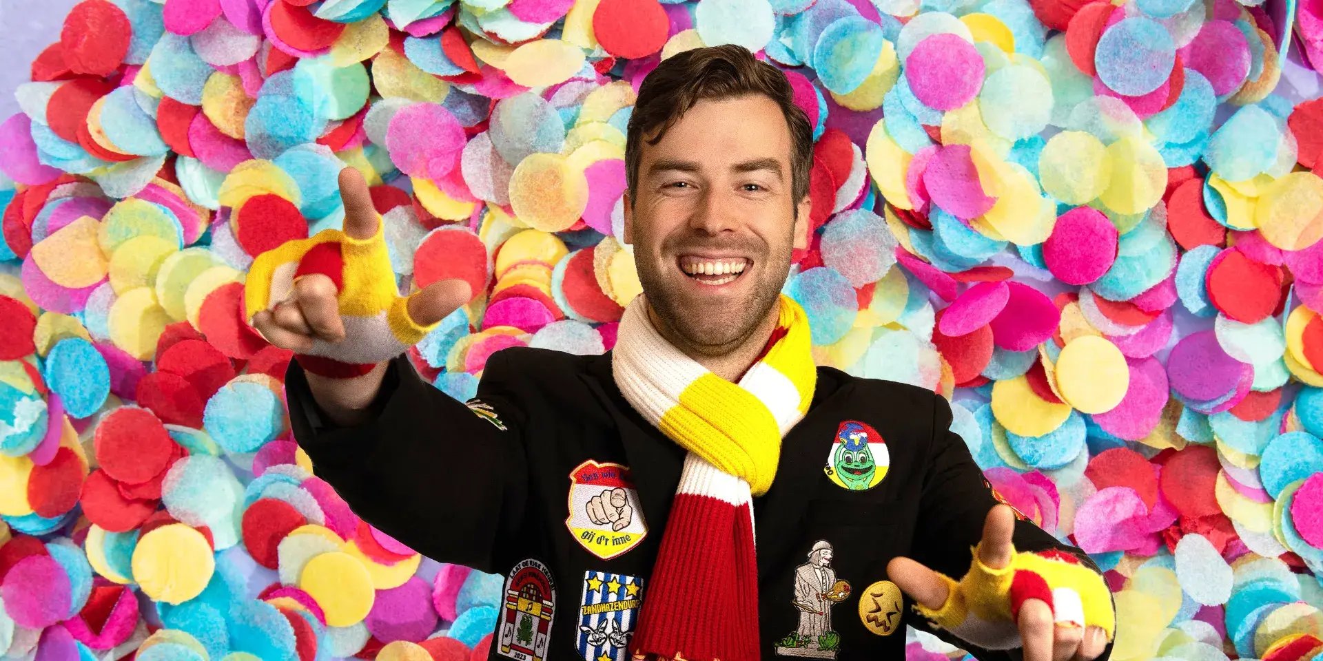 Man in carnival costume and confetti in the background.