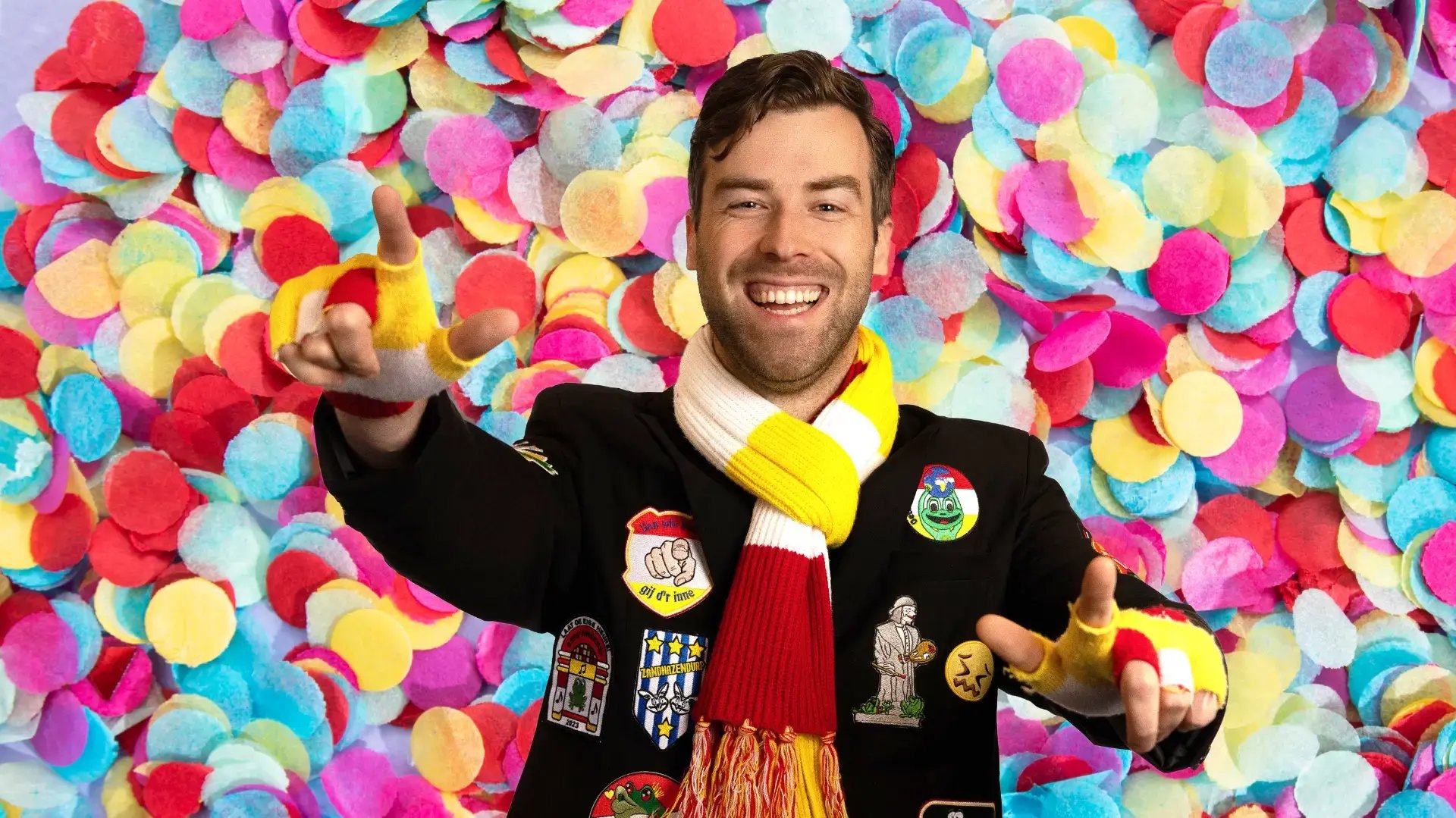 Man in carnival costume and confetti in the background.